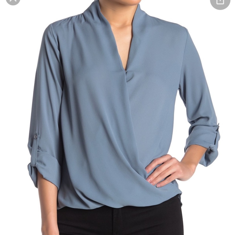 Muted blue faux-wrap shirt. Adjustable sleeves